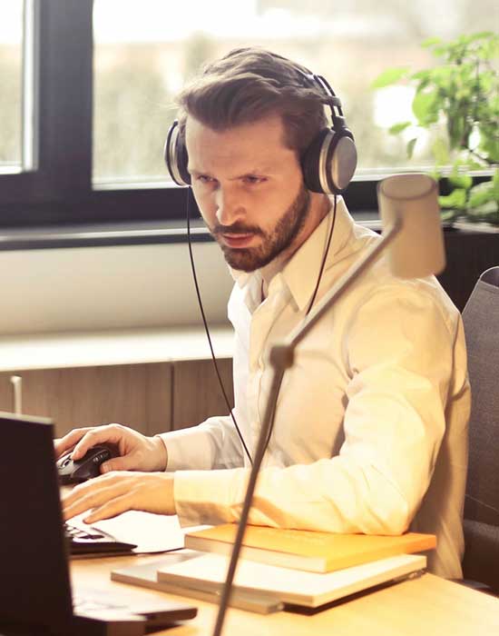 person with headset reading screen