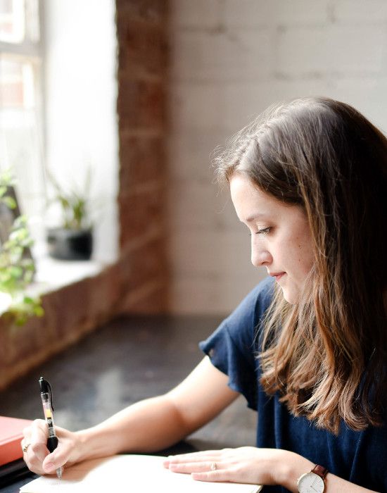 woman signing a contract